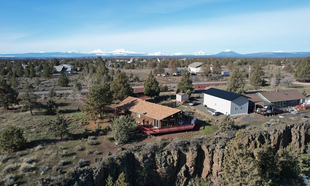 Drone looking back at house with cascades in the background rs 12