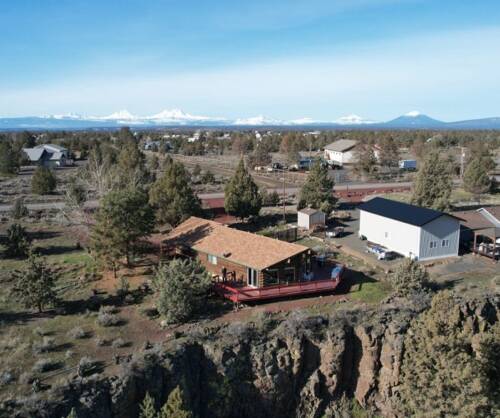 Drone looking back at house with cascades in the background rs 12